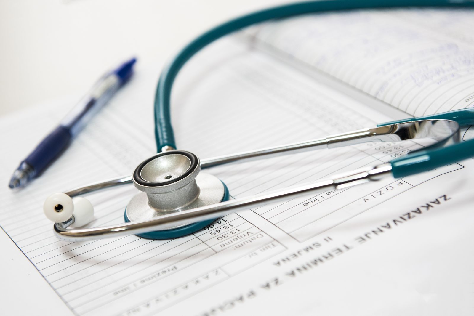 Stethoscope and pen lying on a medical form